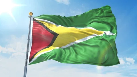 Guyana flag waving in the wind against deep blue sky. National theme. Stock Footage 123983120