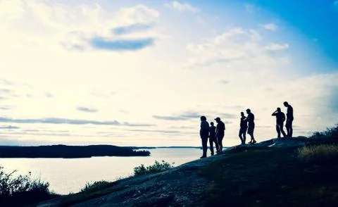Guys checking out the beautiful sunset with a great view Foto stock