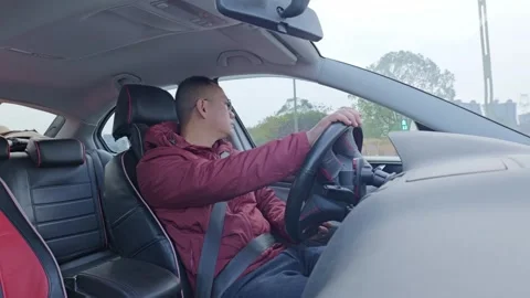 A guy’s checking the road while driving. Stock Footage 329162984