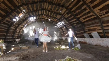 Guys dance and throw apples Stock Footage 85490191