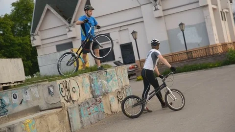Guys do tricks on bicycles Stock Footage 76617854