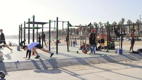 Guys do a workout near the beach Stock Footage 101269632