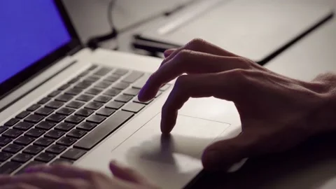 A guy's hand crawling on the touchscreen of a computer Stock Footage 194595691