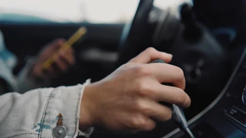 The guy's hand is on the gearshift lever 스톡 동영상 160336604