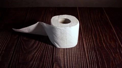 The guy's hand removes the last roll of toilet paper. Stock Footage 165439372