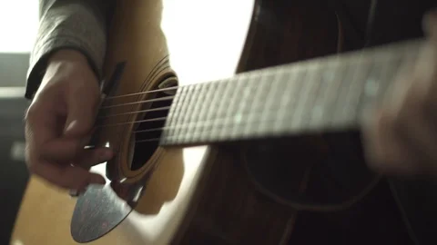 Guy's hands playing the guitar Stock Footage 111384851