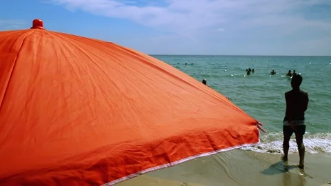 Guys have fun with the ball on the beach Stock Footage 94824045