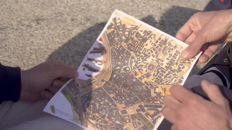 Guys holding map and pointing  Stock Footage 88142071