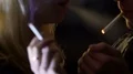 Guys lighting cigarettes and inhaling poisonous nicotine smoke, bad habits HD Footage