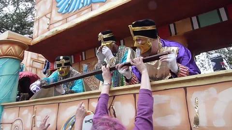 Guys on Mardi Gras float drink from Shotski Stock Footage 52373200