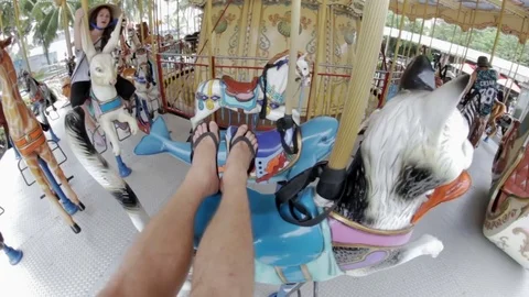 Guys ride on the carousel Stock Footage 73316016