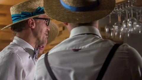 Guys start drinking right there at a counter bar Stock Footage 112201093