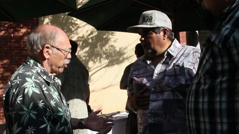 Guys talking at Cannabis event Stock Footage 154563121