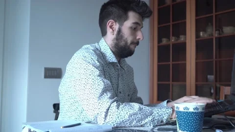 Guys is typing something on his pc while is working from home Stock Footage 132214051