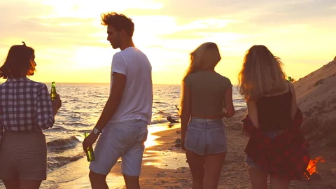 Guys walk on a beach. Stock Footage 95652637