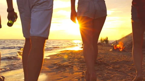 Guys walk on a beach. Stock Footage 95670056