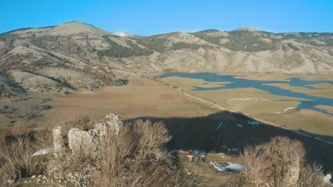 Guys walking with backpack on top of mountain while hiking, trekking in Italy Stock Footage 155337877