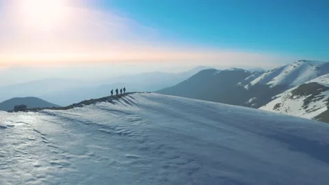 Guys walking on top of mountain in winter with snow. Stock Footage 155337013