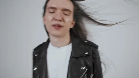 Guytakes the camera in hand and chimes in posing in a dance. Selfies Stock Footage 287915618