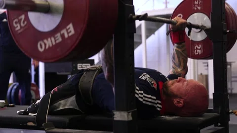 GVs of Paralympic powerlifter Micky Yule training at Powerbase gym Stock Footage 148698144