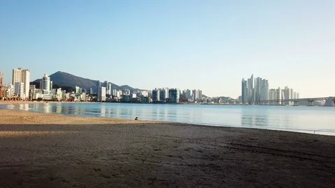 Gwangan Bridge and Haeundae aerial view at Sunrise, Busan, South Korea. Stock Footage 84373353