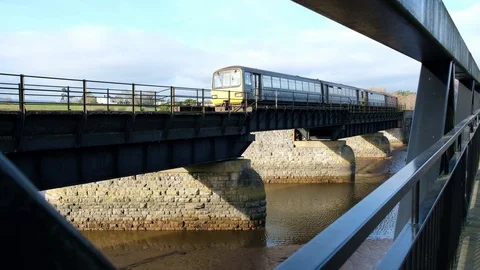 GWR passenger train going over bridge, direction of Exeter-Exmouth Stock Footage