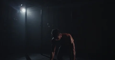 Gym class athletic guy doing push-ups and get sweating in a hard workout Stock Footage 125480430
