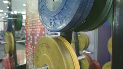 Gym Colourfull Weights on barbell Stock Footage 87437482
