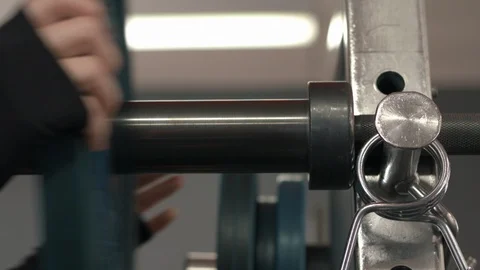 Gym Female loading barbell Stock Footage 87447648
