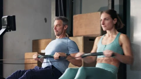 Gym Fitness Workout Exercise Using Rowing Machine Stock Footage 288565493