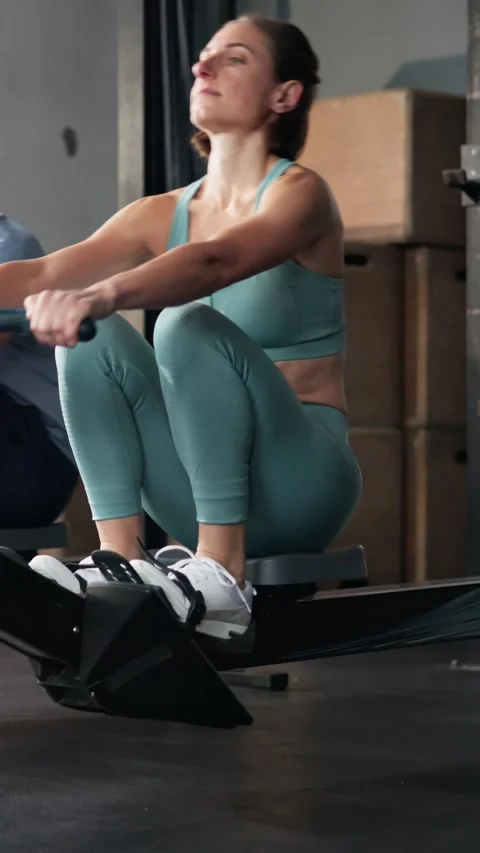 Gym Fitness Workout Exercise Using Rowing Machine Stock Footage 288565915