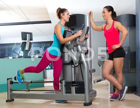 Gym glute exercise machine woman workout Stock Photos