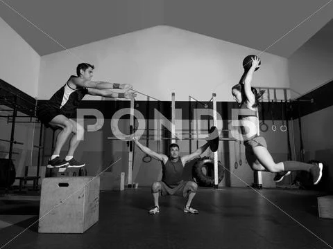 Gym group workout barbells slam balls and jump Stock Photos