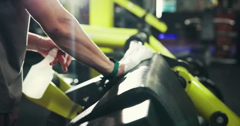 Gym, hands and spray for cleaning equipment, safety or hygiene for maintenance Stock Footage 308534601