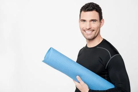Gym instructor holding mat Stock Photos