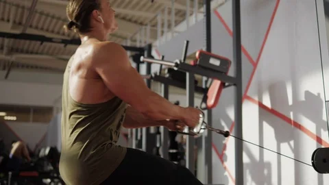 Gym machine row of fit guy Stock Footage 118073614