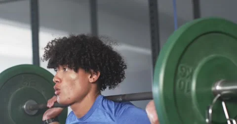 In gym, man lifting weights and focused on strength training Stock-Footage 337704367