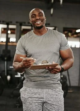 Gym membership, personal trainer and black man holding sign up clipboard for Stock Photos