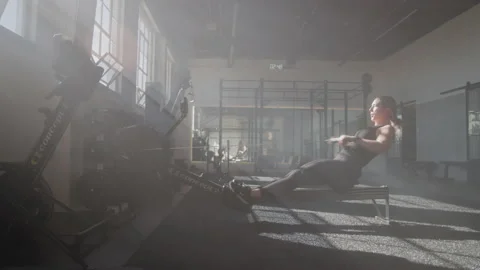 A Gym Owner Working Out on a Rowing Machine Stock Footage 208800493