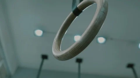 Gym pullup rings hanging from the ceiling Stock Footage 119474453