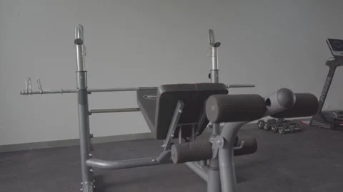 Gym Setup with olympic weight bench machine Stock Footage 262140374