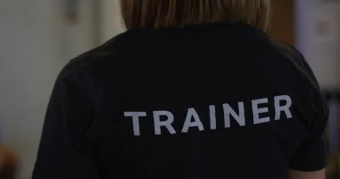 Gym trainer from behind Stock Footage 148246121