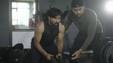 Gym trainer teaching rope exercise for cardio - concept of fitness training Stock Footage 169580949