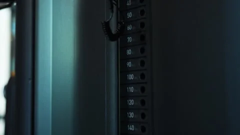 Gym Weight Stack Close-Up With Selector Pin and Resistance Plates in Fitness Stock Footage 328150671