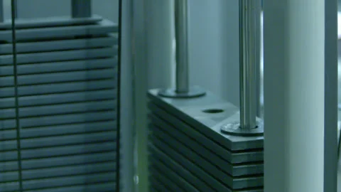 Gym Weight Stack Plates Moving on Cable Machine 動画素材 343098481
