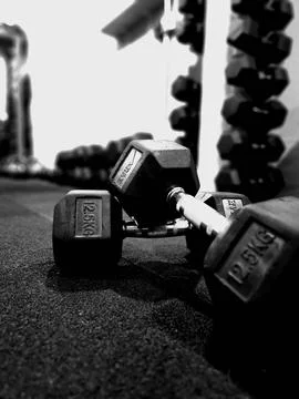 Gym weights stacked creating a backdrop for photos Stock Photos