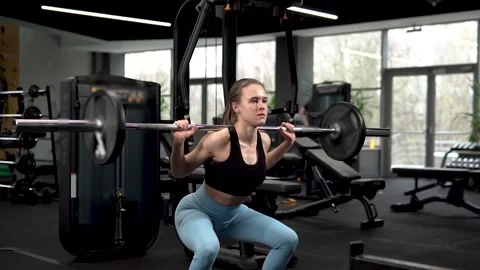 Gym workout squats barbell back fitness doing bodybuilder lifestyle fit, for Stock Footage 194361145