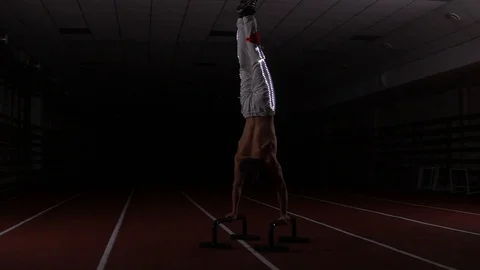 Gymnast doing handstand Stock Footage 129472791