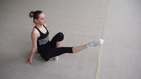 Gymnast doing warm-up. Workout in the gym. Stock Footage 77580137