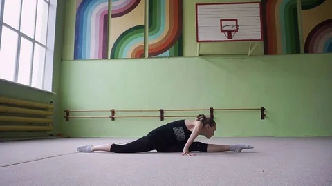 Gymnast doing warm-up. Workout in the gym. Stock Footage 77580477